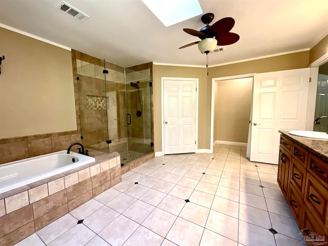 bathroom with a skylight, vanity, separate shower and tub, ceiling fan, and crown molding