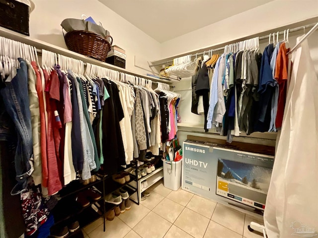 walk in closet featuring tile patterned flooring