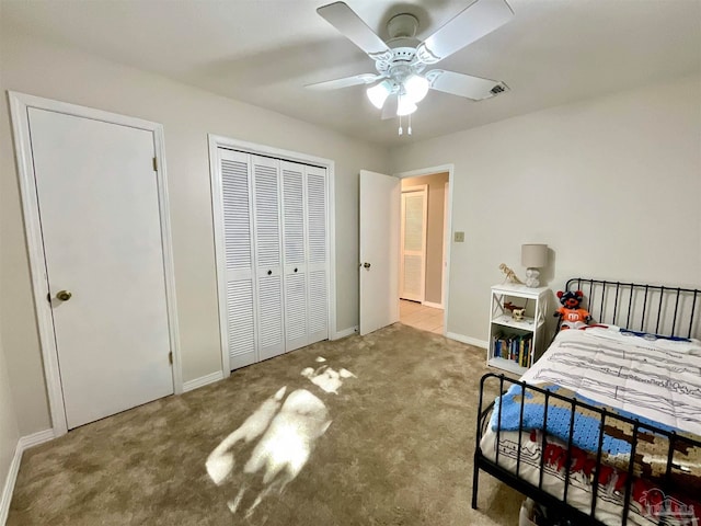 bedroom with ceiling fan and light carpet