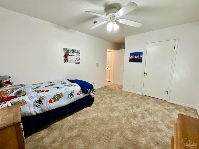 bedroom with light carpet and ceiling fan