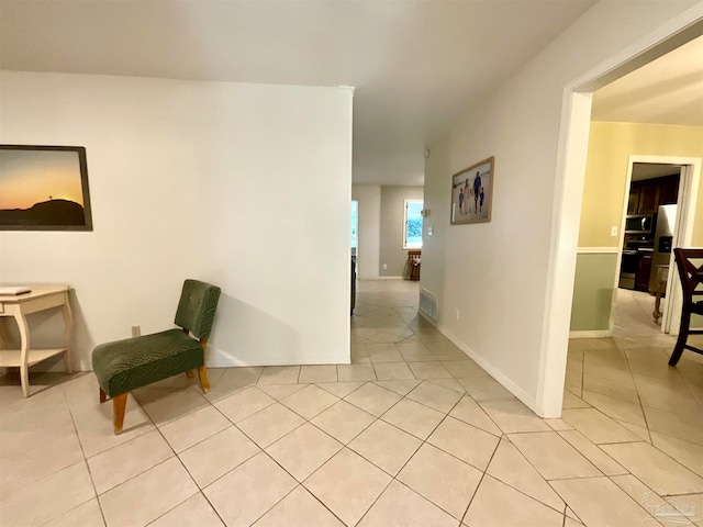 hallway featuring light tile patterned flooring