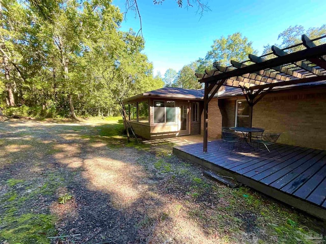 view of yard with a pergola and a wooden deck