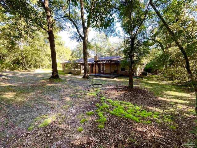 view of yard with a wooden deck