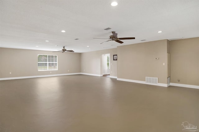 9852 Hillview Dr, Pensacola, FL 32514 - empty room featuring a ceiling fan, recessed lighting, concrete floors, and baseboards