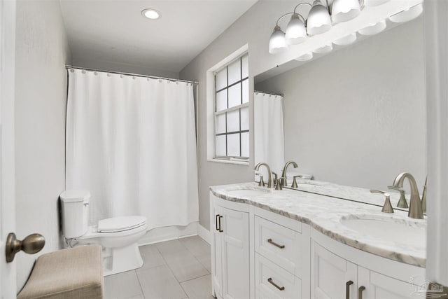 9852 Hillview Dr, Pensacola, FL 32514 - full bathroom featuring toilet, double vanity, tile patterned floors, a shower with shower curtain, and baseboards