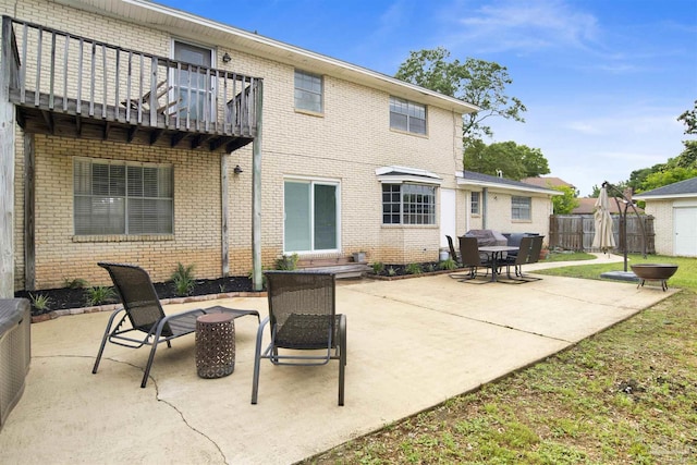 9852 Hillview Dr, Pensacola, FL 32514 - view of patio / terrace featuring an outdoor fire pit