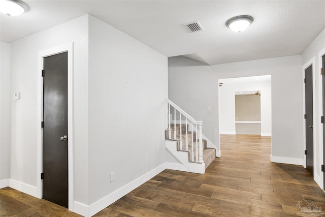 9852 Hillview Dr, Pensacola, FL 32514 - corridor with hardwood / wood-style floors, stairway, and baseboards