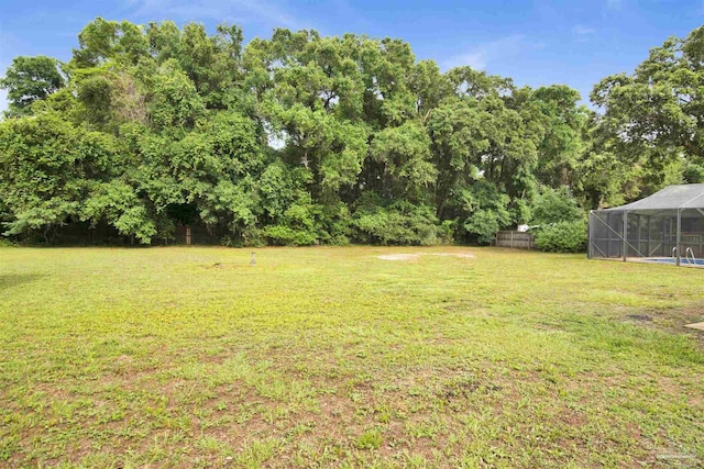 9852 Hillview Dr, Pensacola, FL 32514 - view of green lawn with glass enclosure