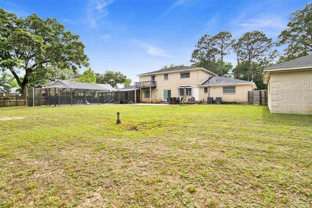 9852 Hillview Dr, Pensacola, FL 32514 - back of house featuring a lanai