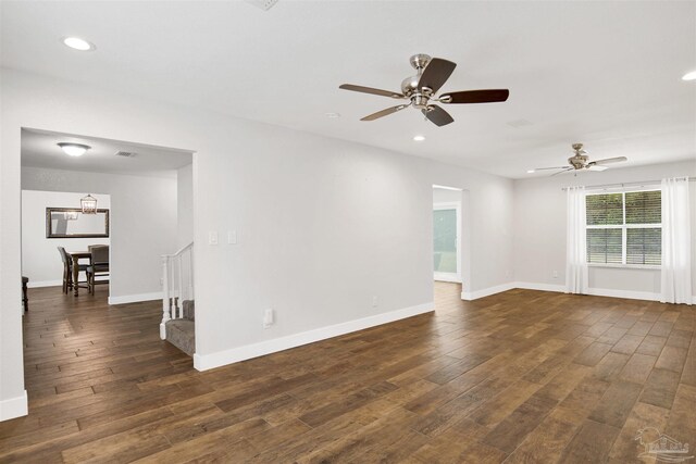 9852 Hillview Dr, Pensacola, FL 32514 - spare room with a ceiling fan, dark wood-style floors, recessed lighting, stairway, and baseboards