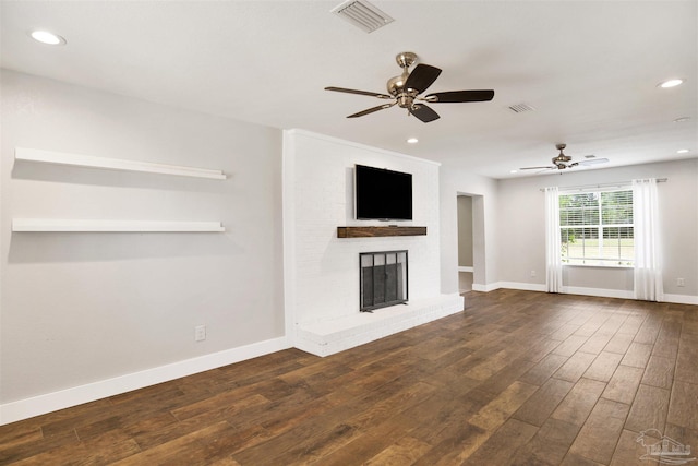 9852 Hillview Dr, Pensacola, FL 32514 - unfurnished living room featuring dark wood-style floors, ceiling fan, a brick fireplace, baseboards, and recessed lighting