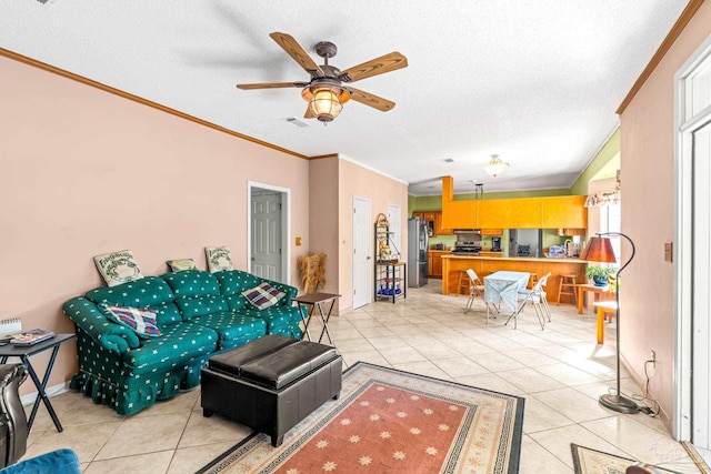 living room with light tile patterned floors, a textured ceiling, crown molding, and ceiling fan