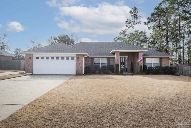 single story home with a garage, fence, concrete driveway, and brick siding