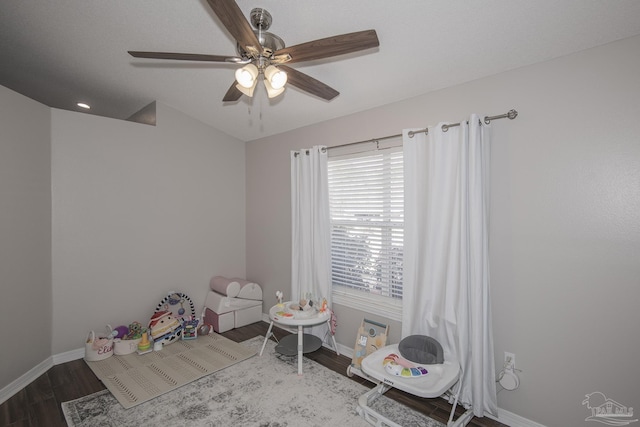 game room featuring ceiling fan, wood finished floors, and baseboards