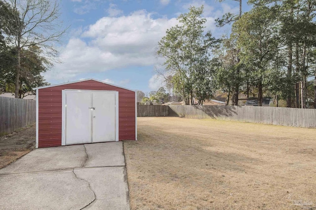 view of shed featuring a fenced backyard