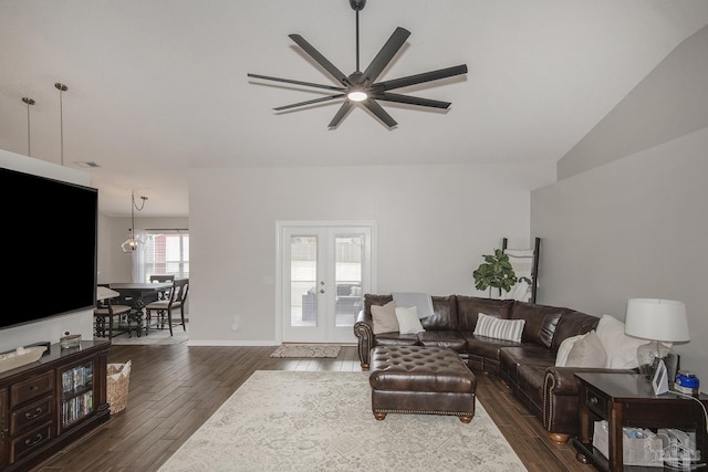 living area with baseboards, dark wood finished floors, a ceiling fan, and french doors