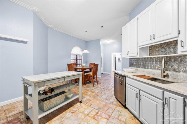 2574 1st Ct, Navarre, FL 32566 - kitchen featuring stainless steel dishwasher, a sink, tasteful backsplash, crown molding, and baseboards