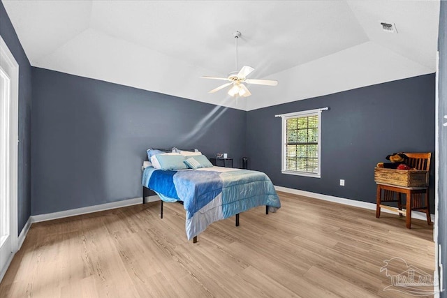 2574 1st Ct, Navarre, FL 32566 - bedroom with vaulted ceiling, wood finished floors, baseboards, and a ceiling fan