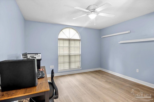 2574 1st Ct, Navarre, FL 32566 - office space featuring a ceiling fan, wood finished floors, and baseboards