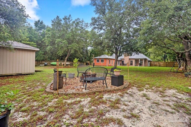 2574 1st Ct, Navarre, FL 32566 - view of yard featuring an outdoor structure and view of scattered trees