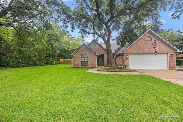 2574 1st Ct, Navarre, FL 32566 - view of front of house with brick siding, a front lawn, concrete driveway, and an attached garage
