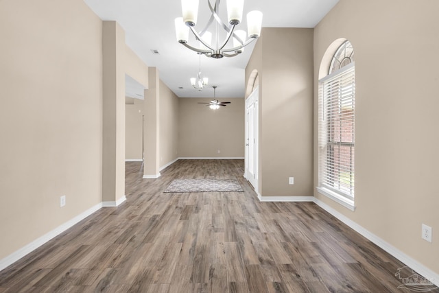 interior space with hardwood / wood-style flooring and a chandelier