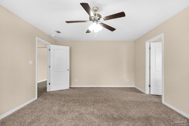 spare room featuring carpet and ceiling fan