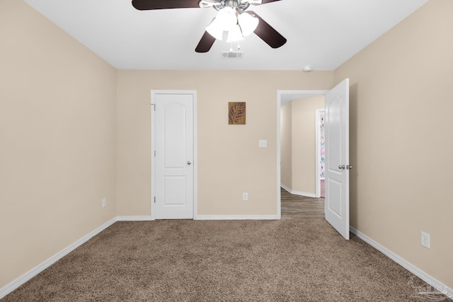 unfurnished bedroom with light carpet and ceiling fan