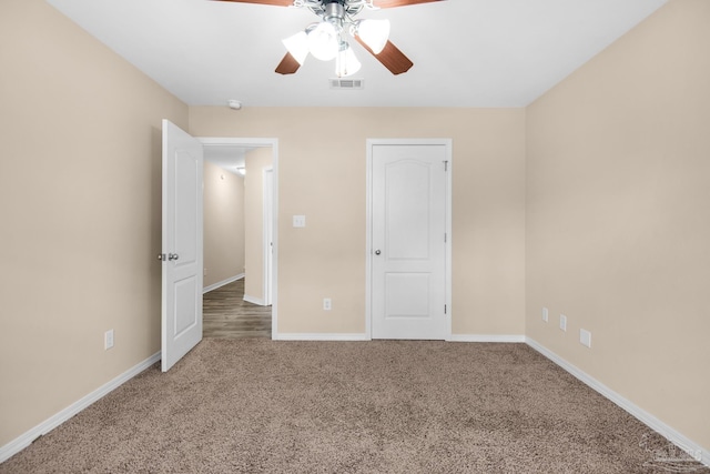 unfurnished bedroom featuring carpet and ceiling fan