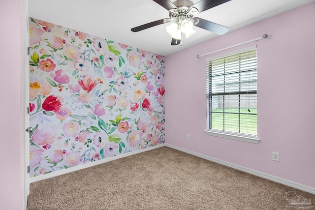 unfurnished room with carpet flooring, a wealth of natural light, and ceiling fan