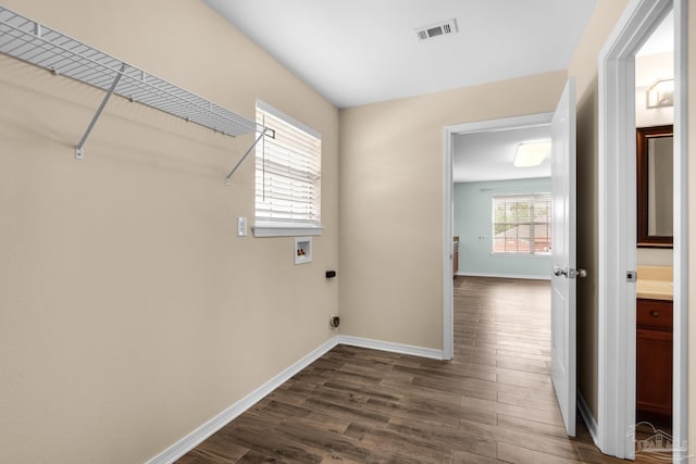 washroom with hookup for a washing machine, electric dryer hookup, and dark hardwood / wood-style flooring