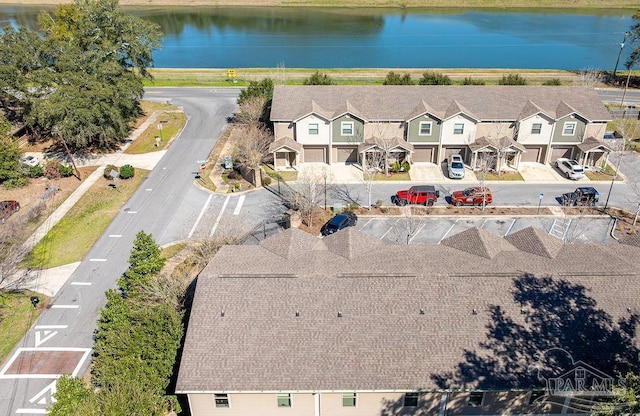 bird's eye view with a water view and a residential view