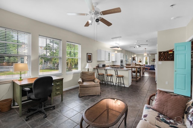 tiled living room featuring ceiling fan