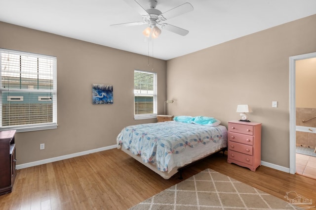 bedroom featuring connected bathroom, ceiling fan, and hardwood / wood-style flooring