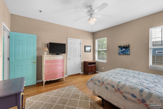 bedroom featuring ceiling fan and hardwood / wood-style flooring