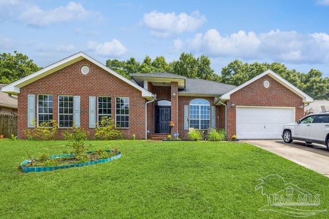 ranch-style home with a garage and a front lawn