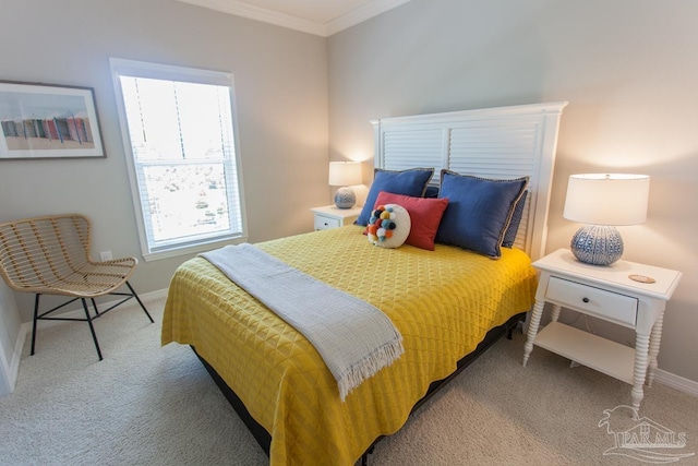 carpeted bedroom with baseboards and crown molding