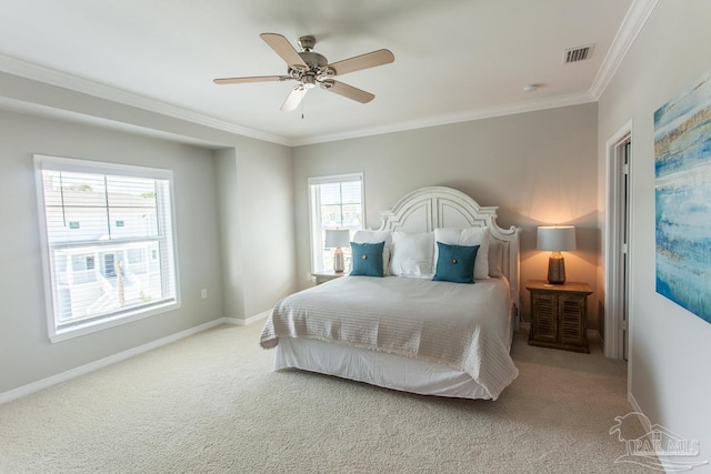 bedroom with light colored carpet, ornamental molding, and ceiling fan