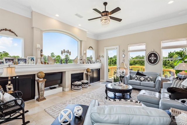 living room with ornamental molding, light tile patterned floors, and ceiling fan