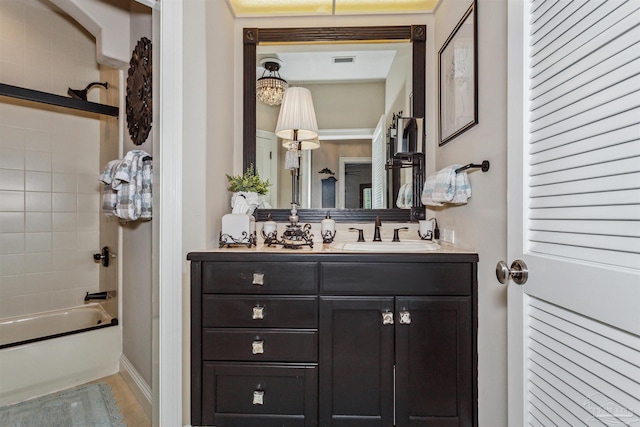 bathroom with vanity and washtub / shower combination