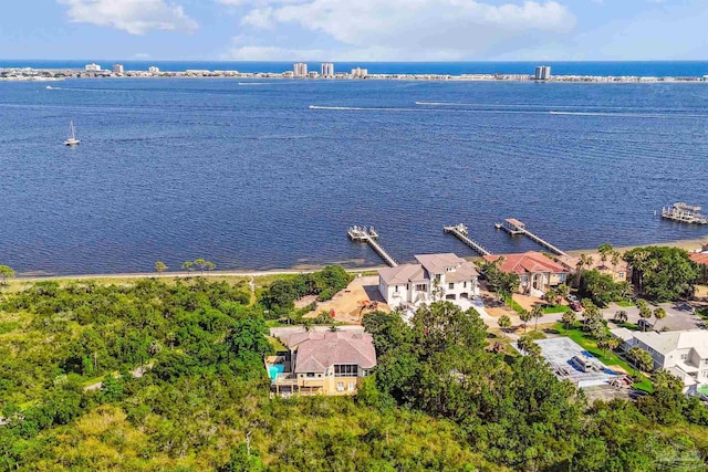 drone / aerial view with a water view and a residential view