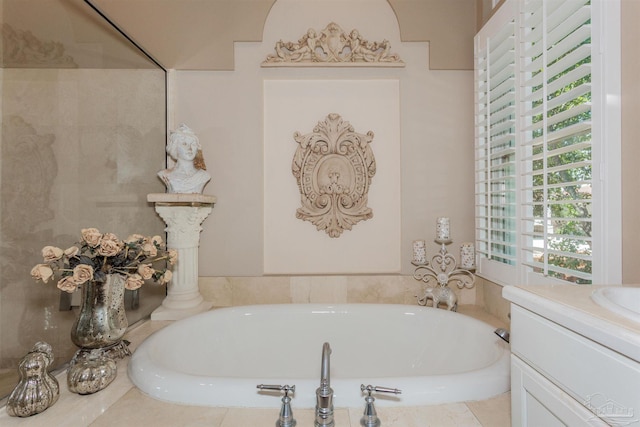 bathroom featuring a tub and vanity