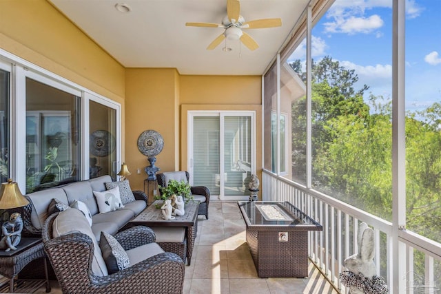 sunroom featuring a wealth of natural light and ceiling fan