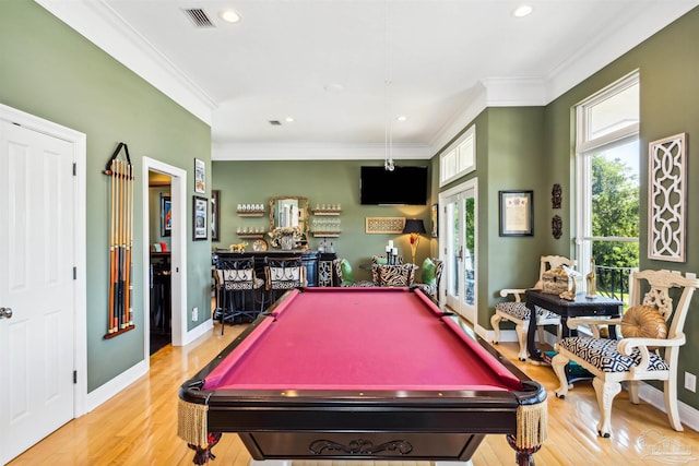 game room featuring light hardwood / wood-style floors, ornamental molding, and billiards