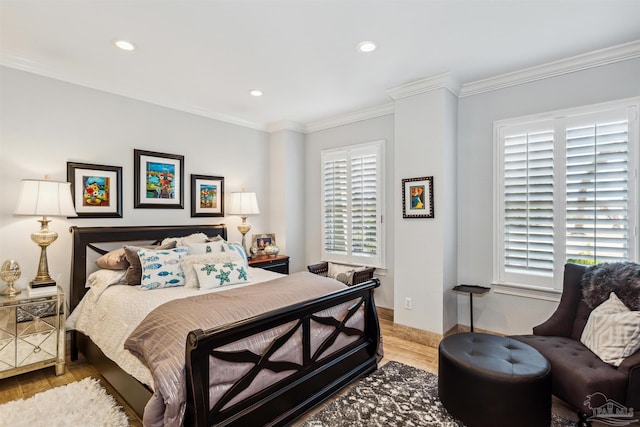 bedroom with light wood-type flooring, crown molding, baseboards, and recessed lighting