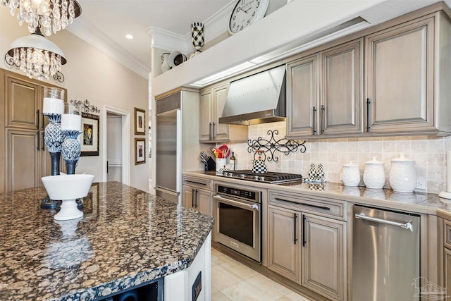 kitchen with tasteful backsplash, stainless steel appliances, crown molding, a chandelier, and wall chimney exhaust hood