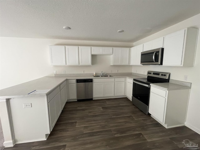 kitchen with white cabinets, stainless steel appliances, and sink