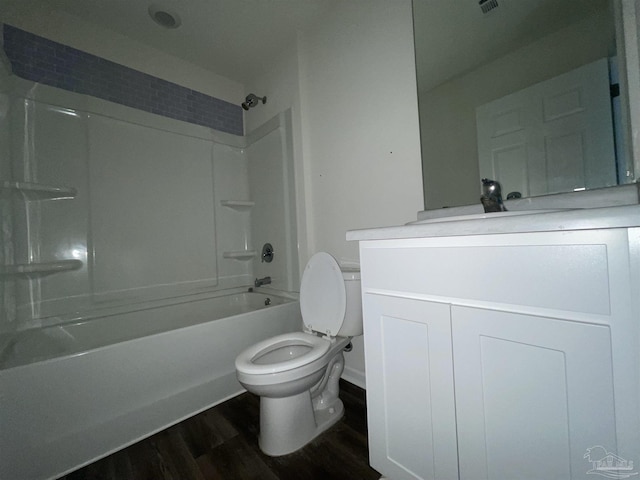 full bathroom with hardwood / wood-style flooring, vanity, toilet, and bathtub / shower combination