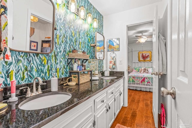 2803 Venetian Way, Gulf Breeze, FL 32563 - full bathroom with connected bathroom, double vanity, wood finished floors, and ceiling fan