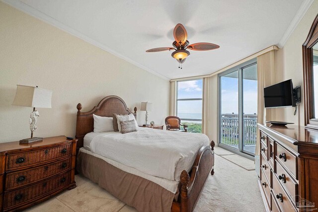 bedroom featuring light carpet, access to exterior, ceiling fan, crown molding, and a wall of windows